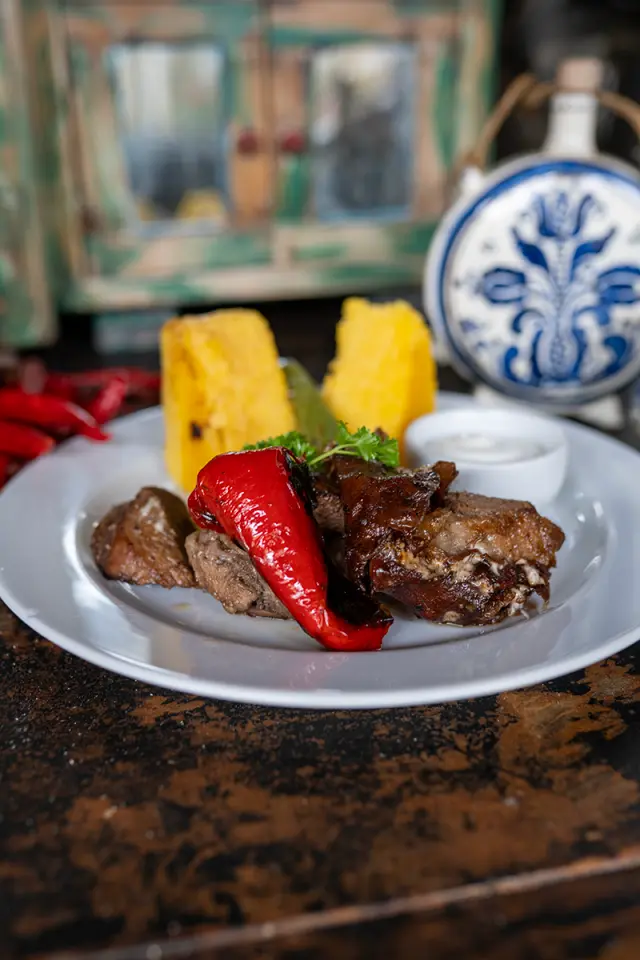 Branding photo of a traditional homemade dish from Sibiu served in a rustic setting, highlighting local cuisine and authentic presentation.