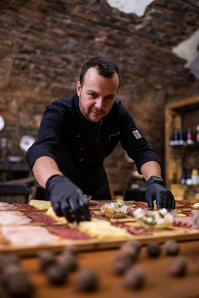 Chef preparing food at Conacul Maria Theresa, Sibiu